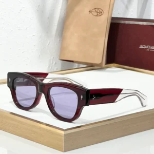 JMM Chelsea Cherry sunglasses with translucent cherry-red acetate frame, lavender lenses and clear temple tips