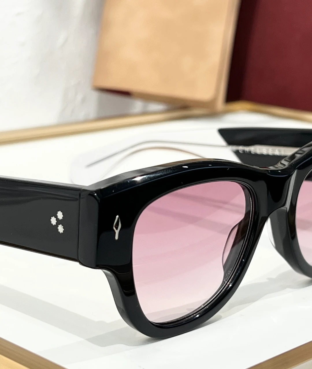 JMM Chelsea Black Pink sunglasses with glossy black acetate frame, soft pink lenses and transparent temple tips
