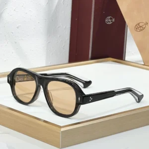 JMM Duende Black Champagne sunglasses with glossy black acetate frame, warm champagne lenses and silver-tone detailing