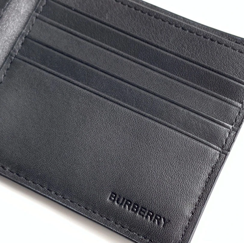 Burberry black calfskin bifold wallet with embossed TB Monogram pattern