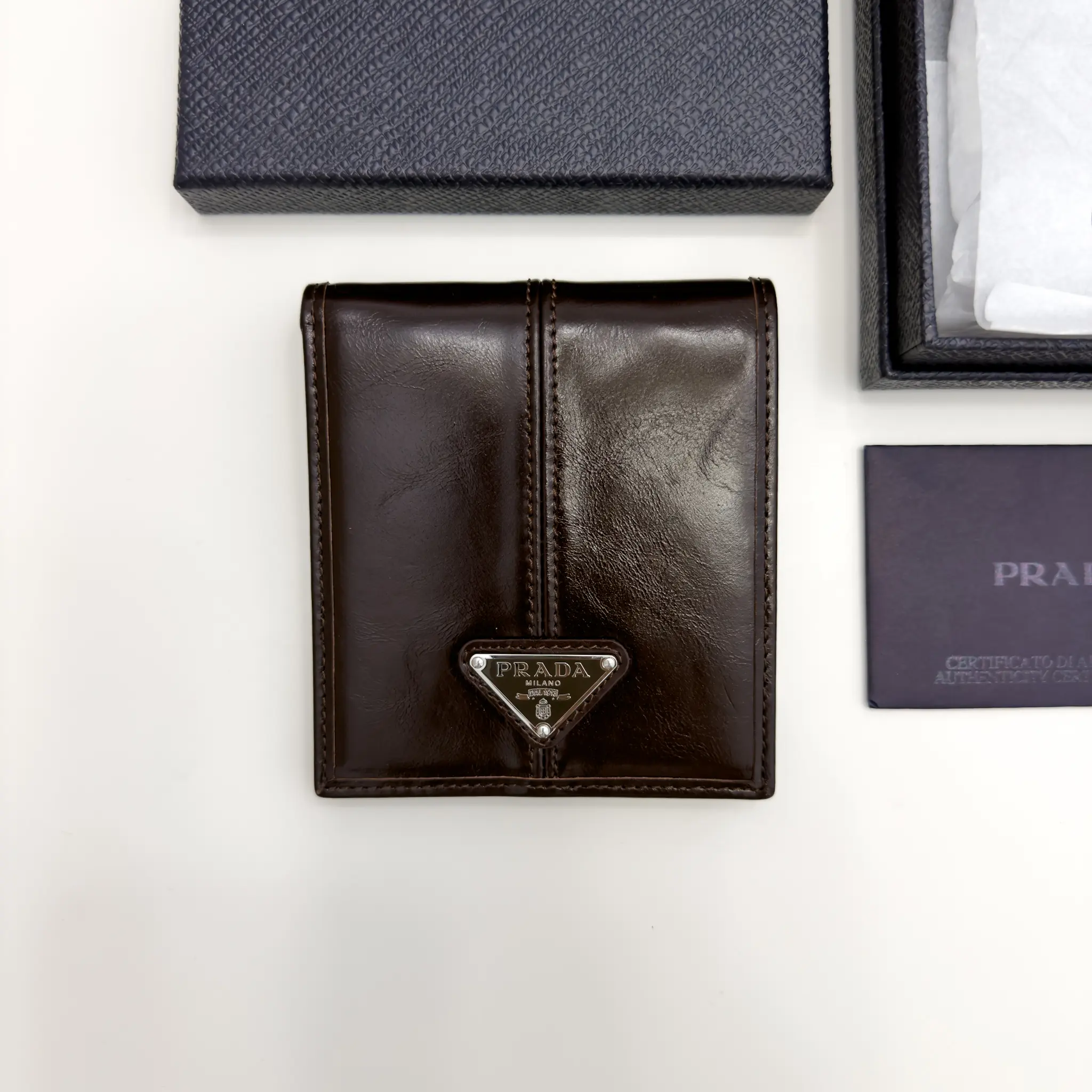 Prada dark brown calfskin bifold wallet with enameled triangle logo
