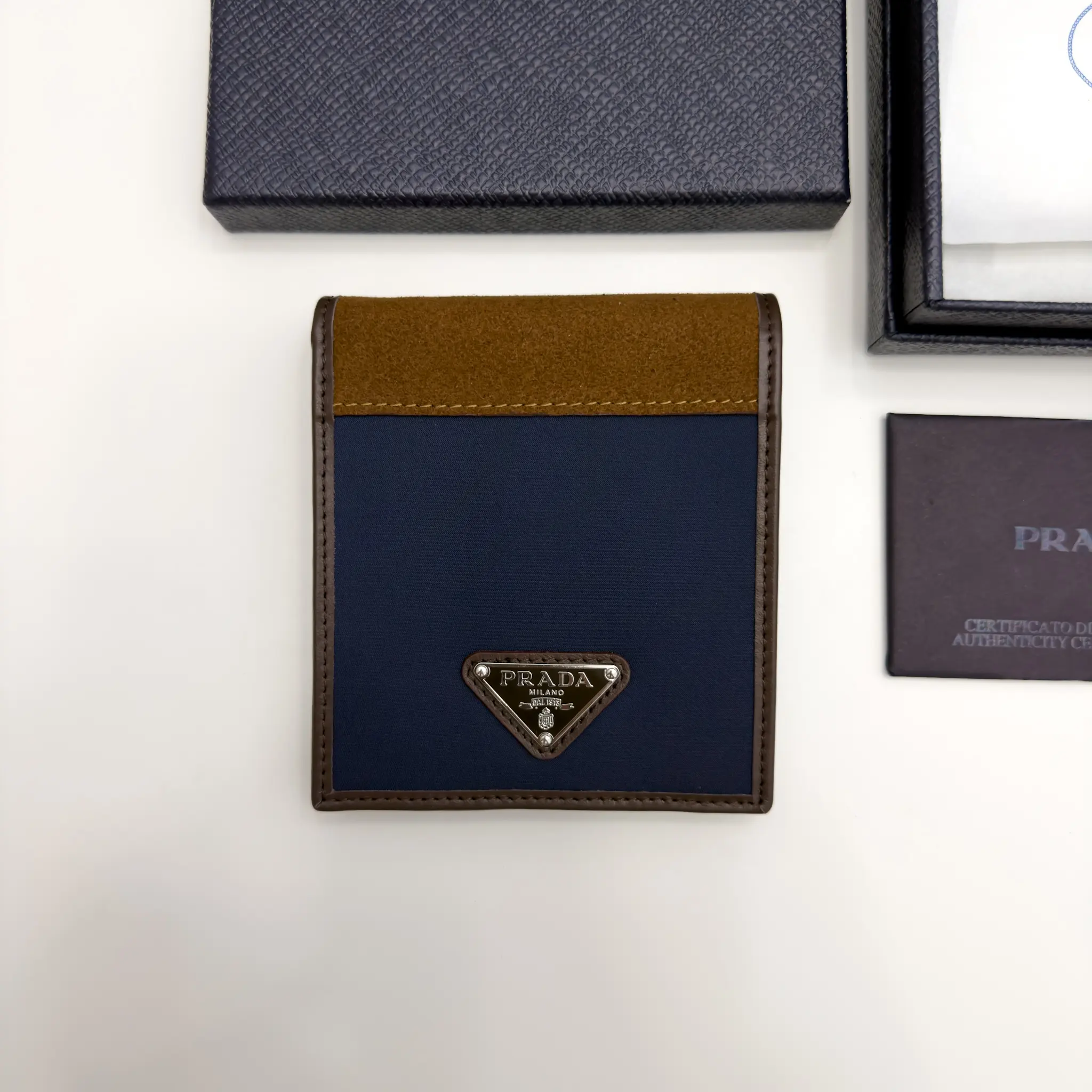 Prada navy Re-Nylon bifold wallet with brown suede detail and triangle logo