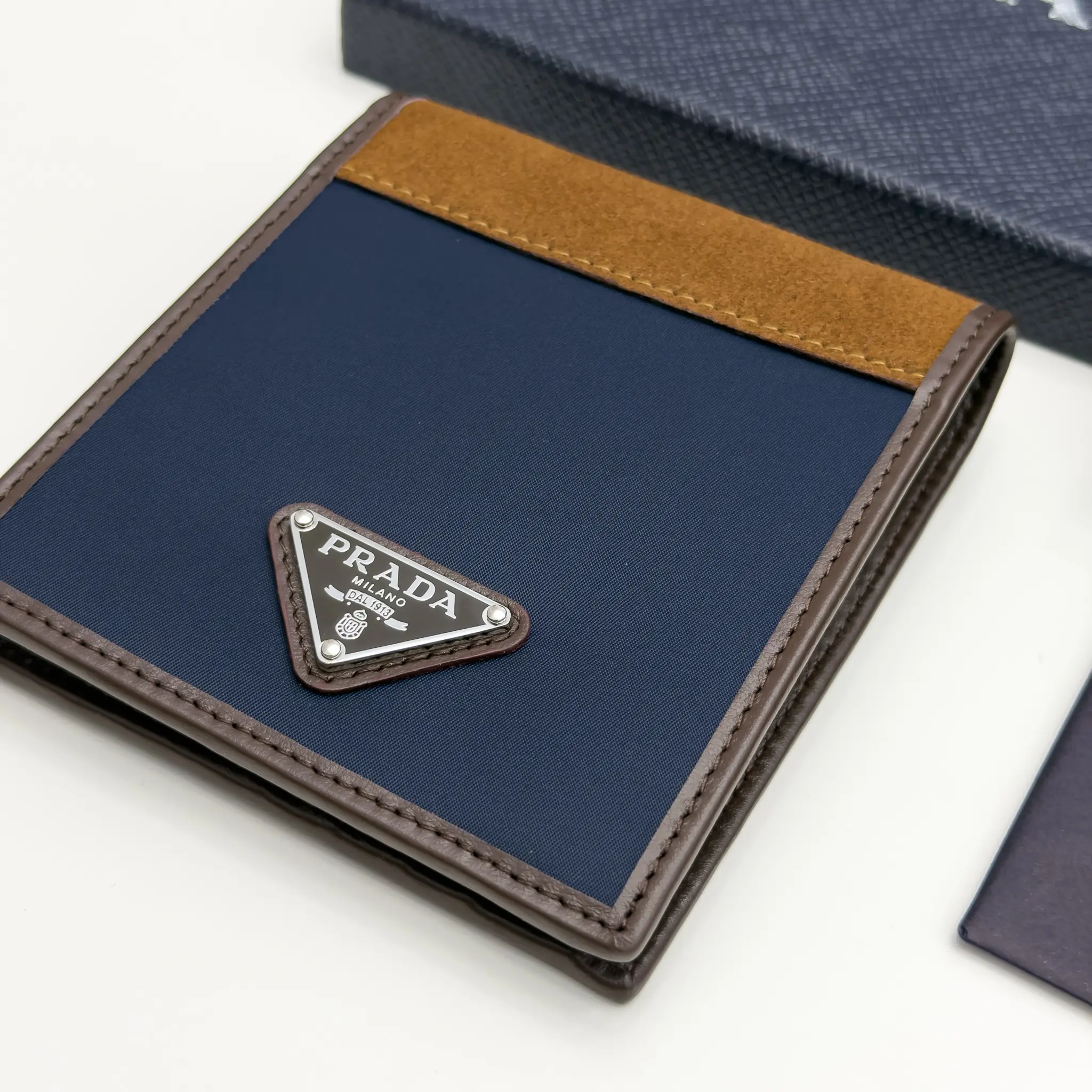 Prada navy Re-Nylon bifold wallet with brown suede detail and triangle logo