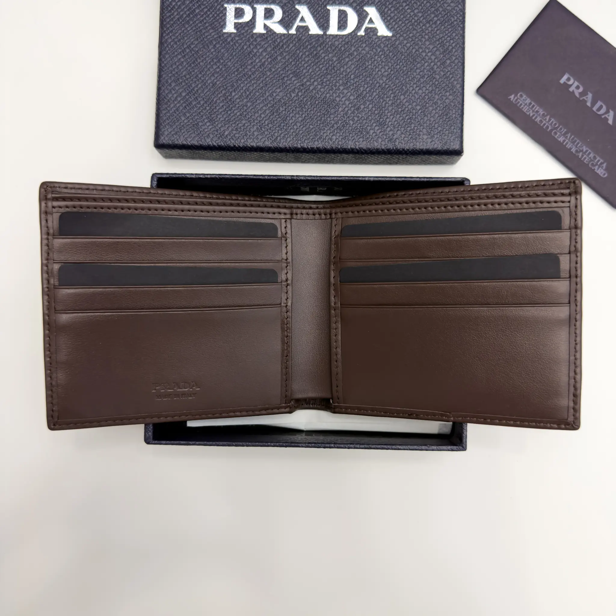 Prada navy Re-Nylon bifold wallet with brown suede detail and triangle logo