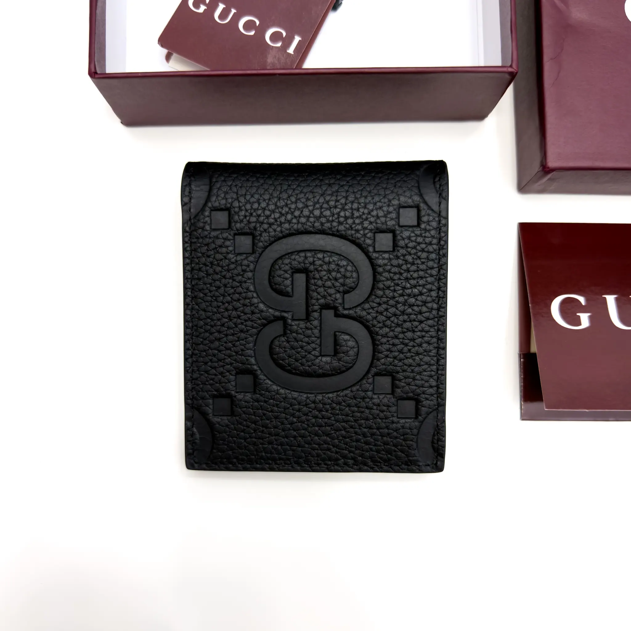 Gucci Jumbo GG black grained leather bifold wallet with oversized tonal GG motif