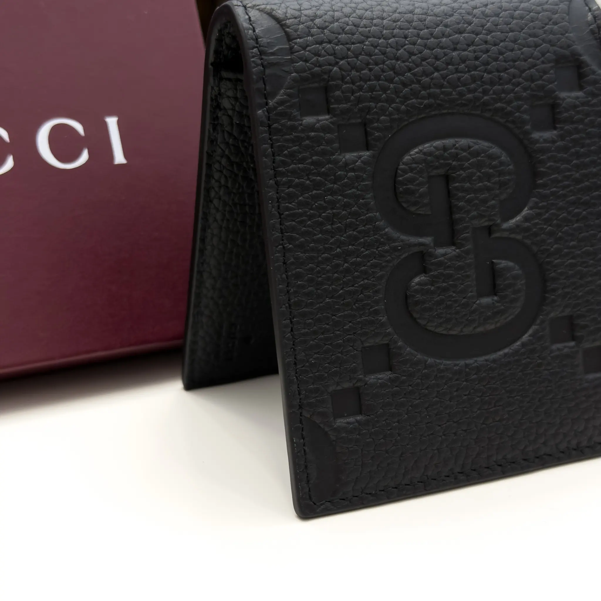 Gucci Jumbo GG black grained leather bifold wallet with oversized tonal GG motif