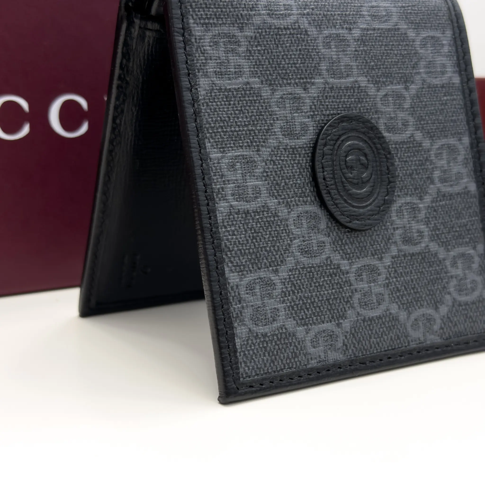 Gucci Interlocking G black and grey GG Supreme bifold wallet with black leather trim