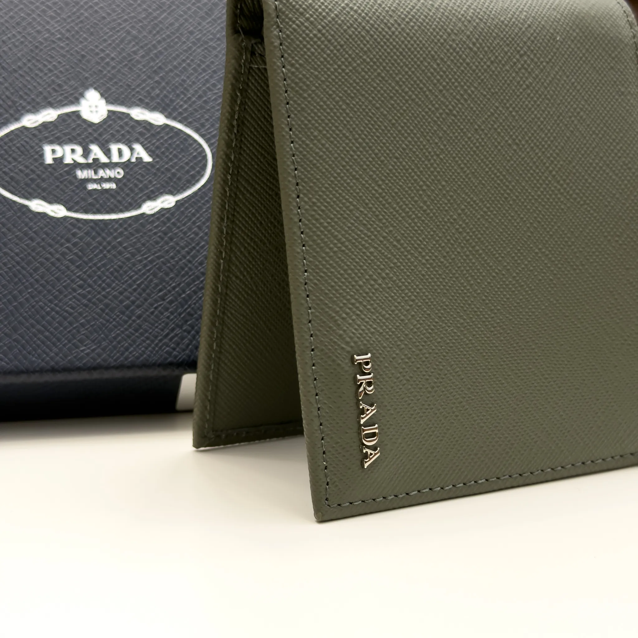 Prada Selva Green Saffiano leather bifold wallet with metal lettering logo