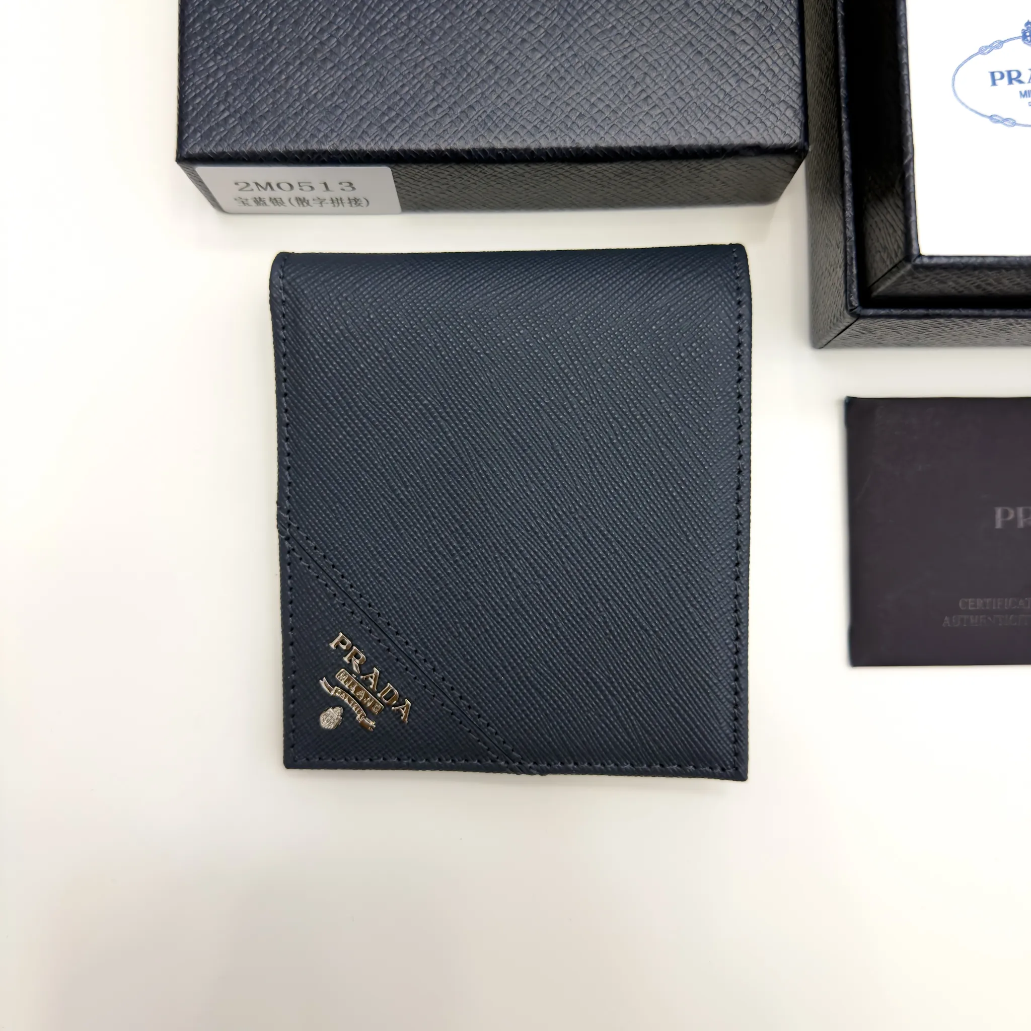 Prada Baltic Blue Saffiano leather bifold wallet with intarsia corner detail and metal logo