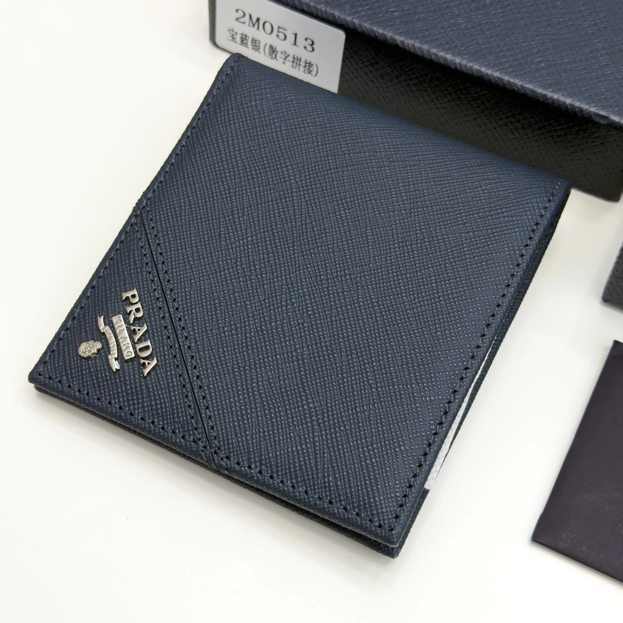 Prada Baltic Blue Saffiano leather bifold wallet with intarsia corner detail and metal logo