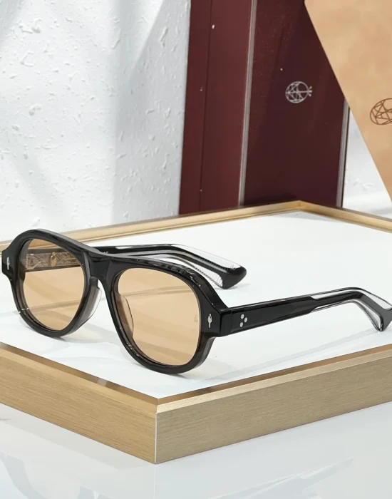 JMM Duende Black Champagne sunglasses with glossy black acetate frame, warm champagne lenses and silver-tone detailing