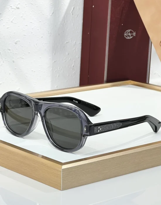 JMM Duende Crystal Dark Grey sunglasses with translucent grey acetate frame, dark smoke lenses and patterned black temples