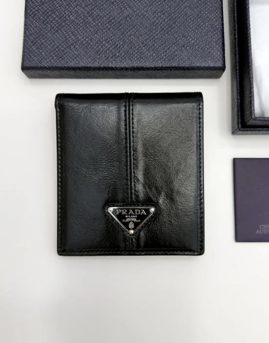 Prada black calfskin bifold wallet with enameled triangle logo