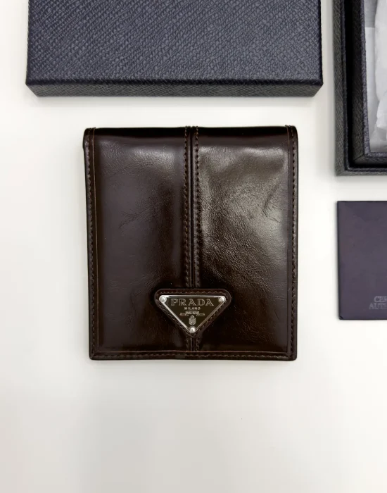 Prada dark brown calfskin bifold wallet with enameled triangle logo