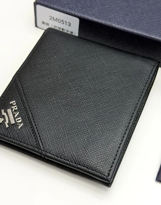 Prada black Saffiano leather bifold wallet with intarsia corner detail and metal logo